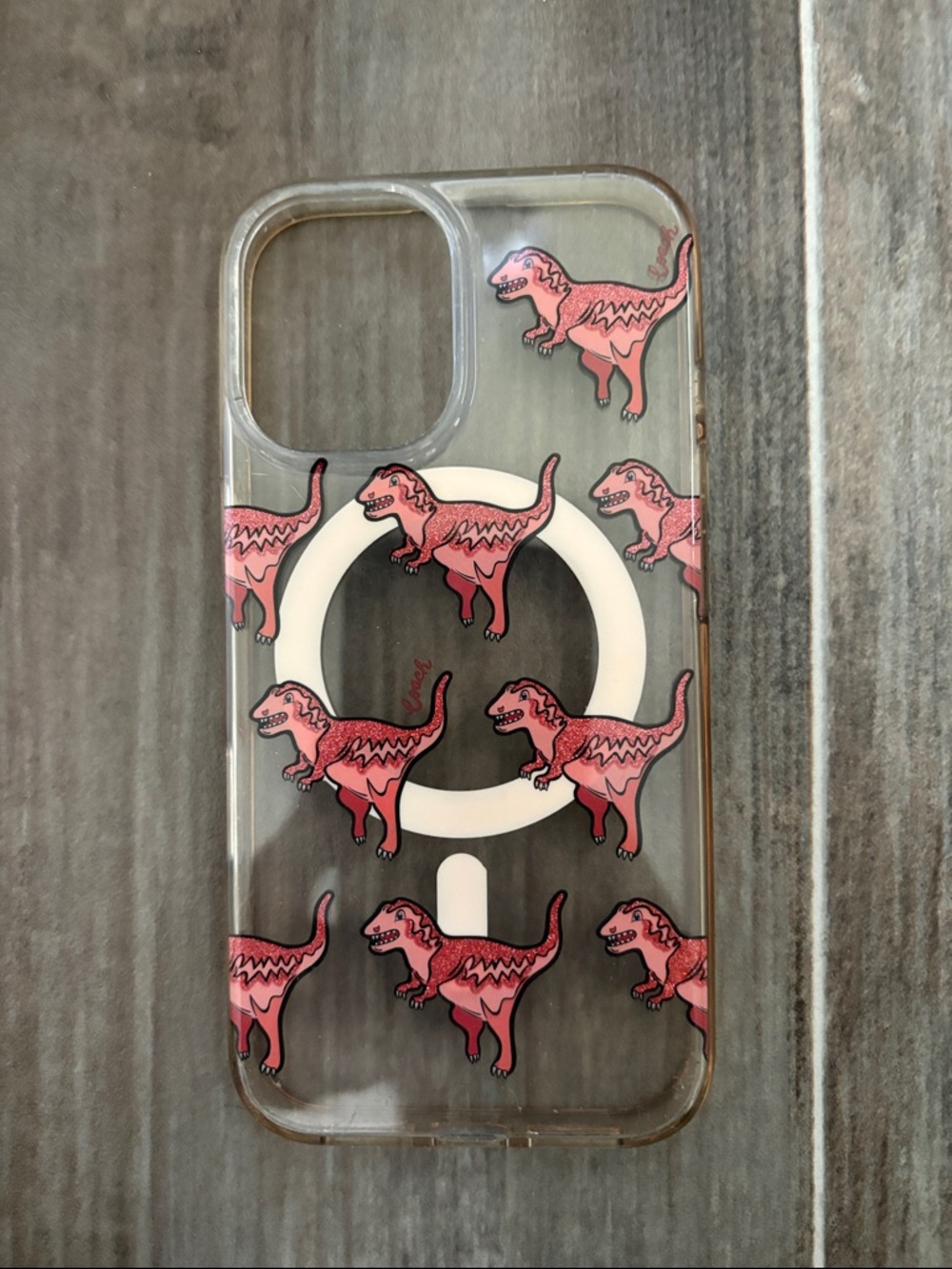 Clear COACH  iPhone 16 Case with Pink Dinosaur Pattern